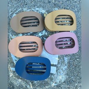 Brand new in plastic set of 5 flat hair clips, matte colors, lay flat design